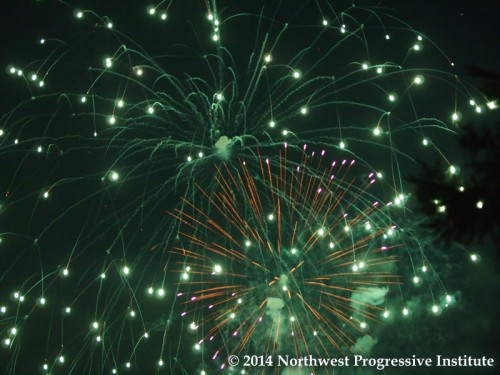 Fireworks explode over the Kirkland waterfront