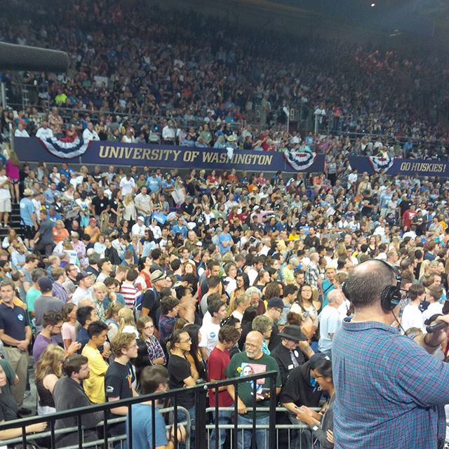 It is packed from floor to ceiling. Audience is doing a Bernie wave!