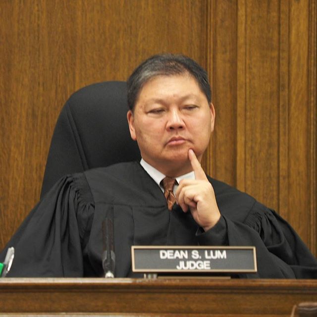 Judge Dean Lum listens to oral argument in Huff v. Wyman