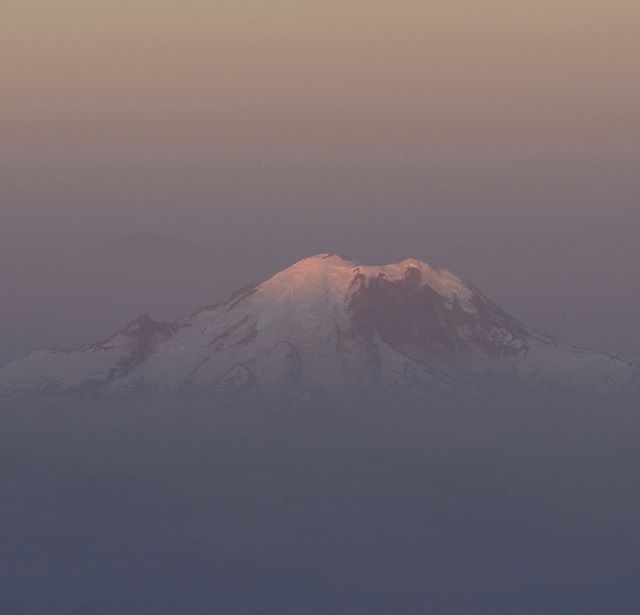 Dawn’s early light strikes Mount Rainier on a very smoky morning