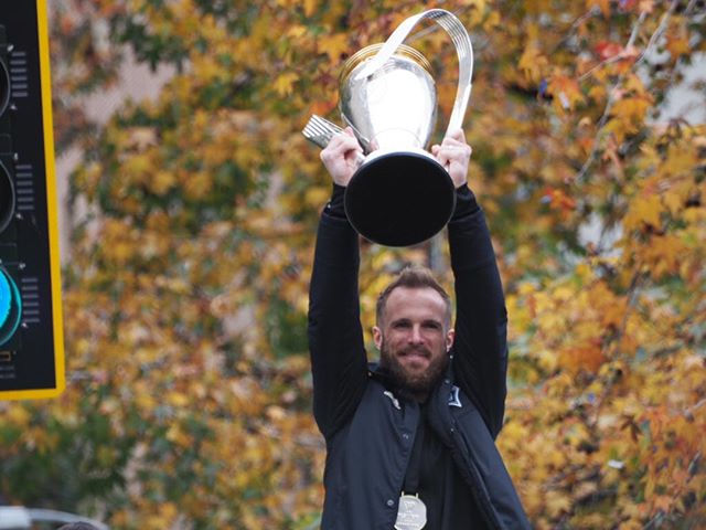 Scenes from the 2019 Sounders' championship parade: Stefan Frei raises the Philip Anschutz Trophy