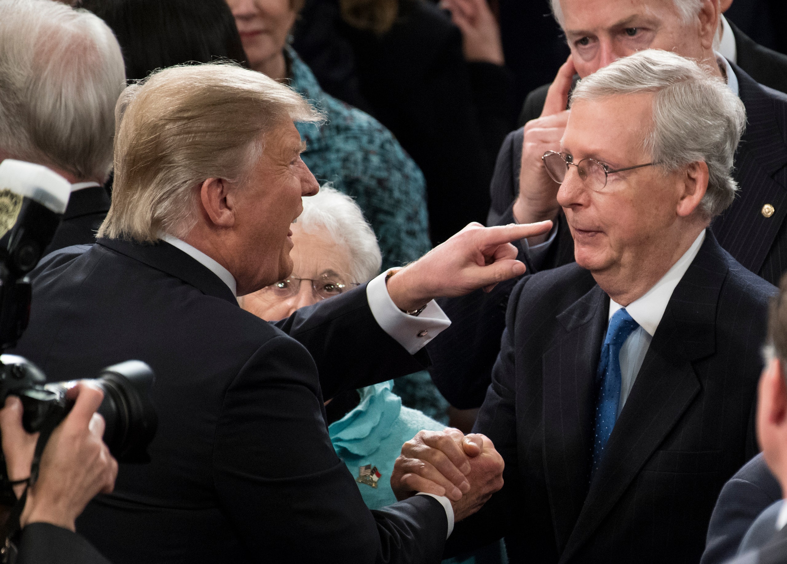 Donald Trump points at Mitch McConnell