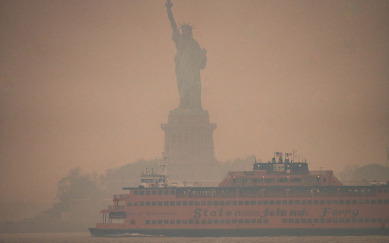 Wildfire smoke obscures the Statue of Liberty in June 2023