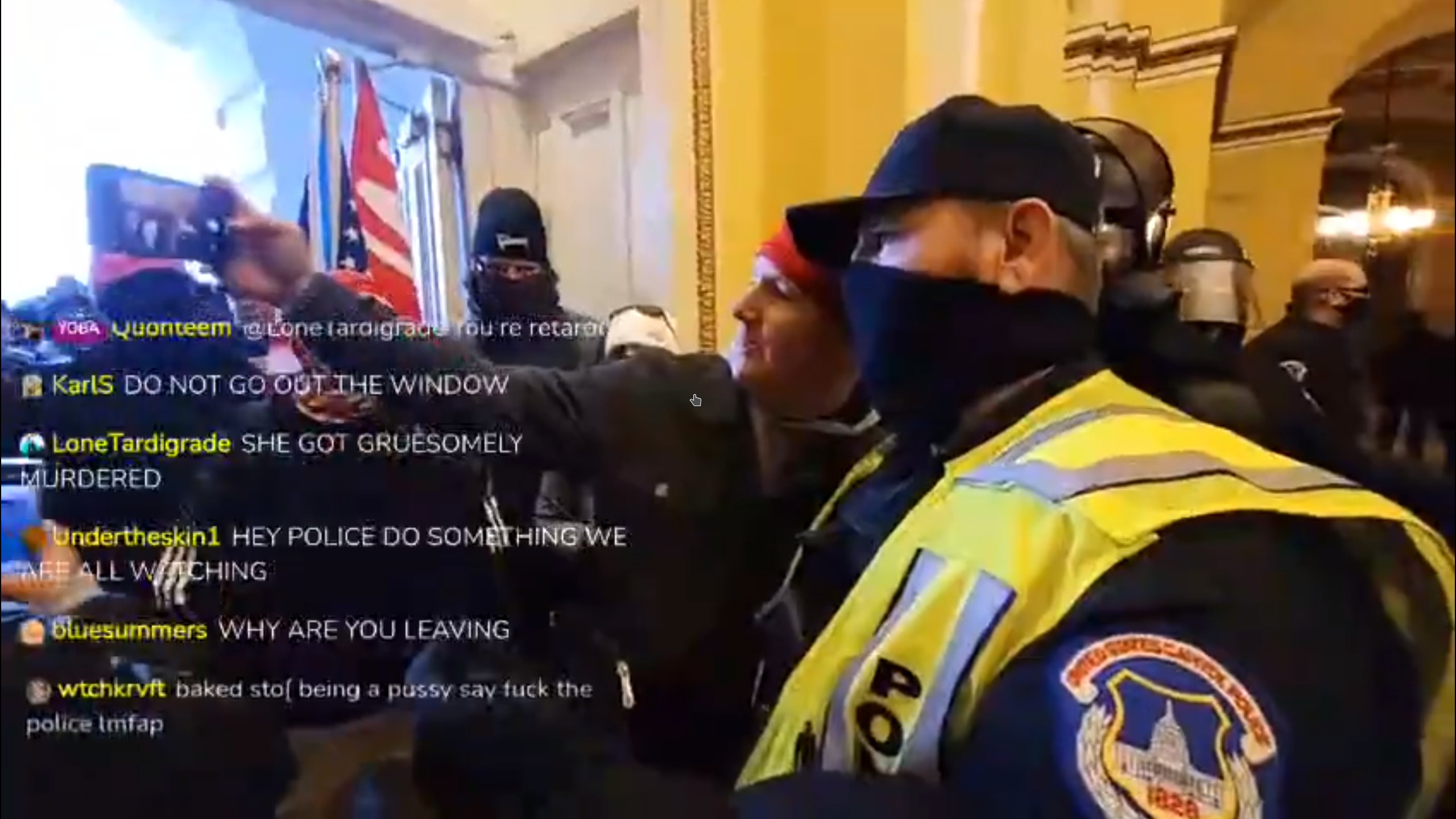 A cop taking a selfie with a trespasser in the Capitol