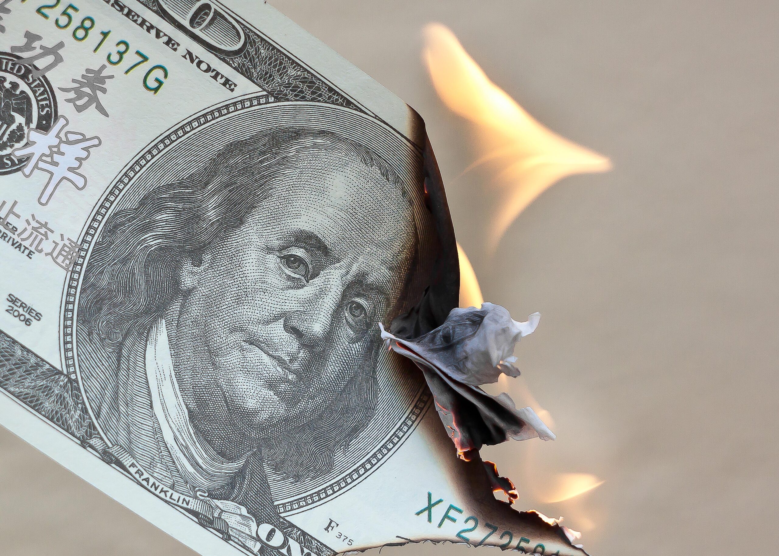 A hundred dollar bill burning