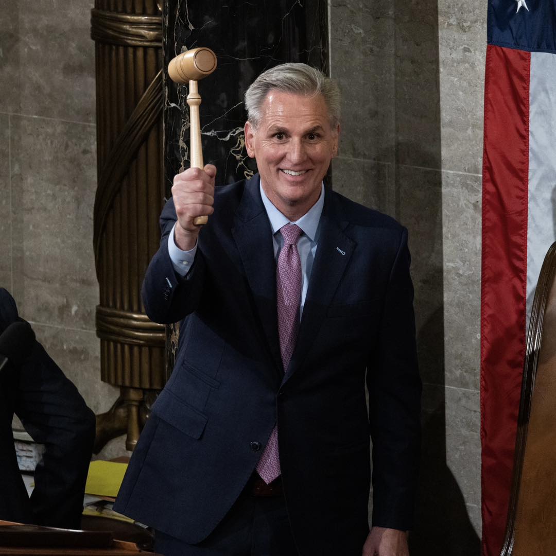 Kevin McCarthy grins as he grips a gavel
