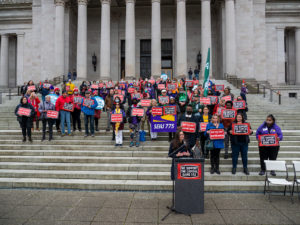 Capital gains tax supporters rally at the Washington State Capitol
