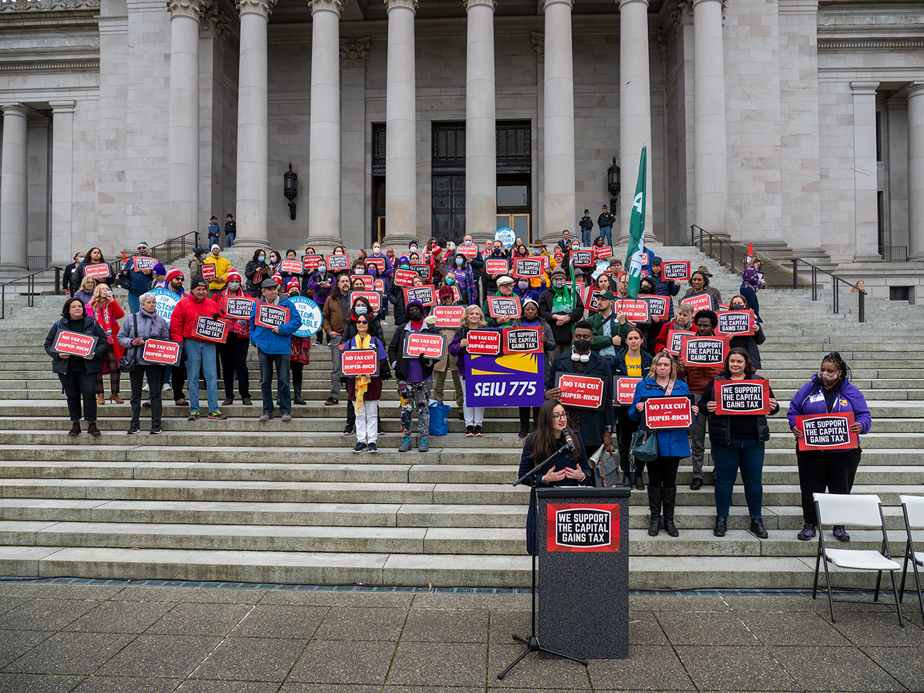 Capital gains tax supporters rally at the Washington State Capitol