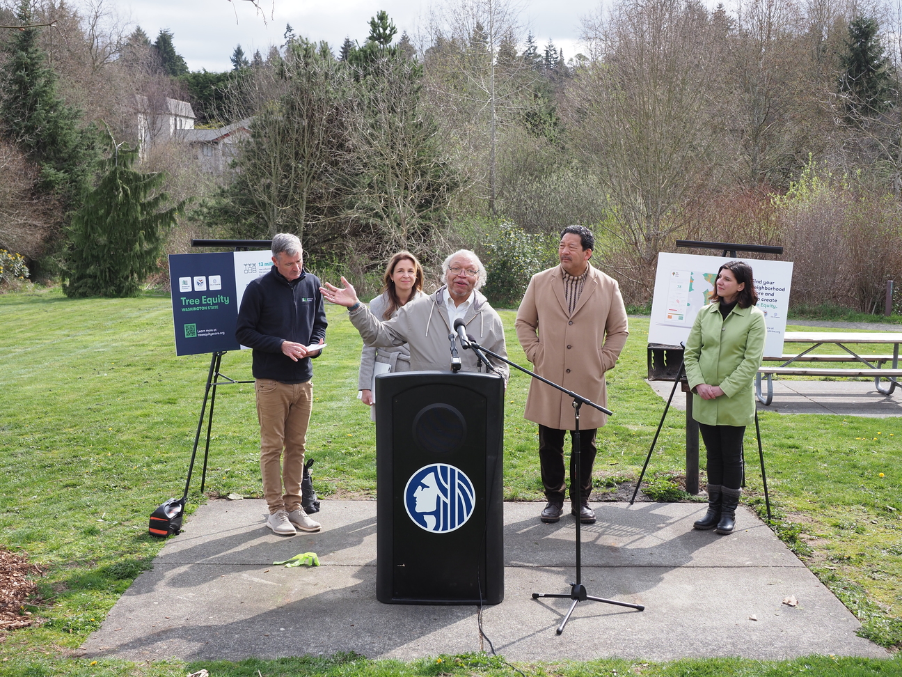 Speakers at a press conference announcing the first statewide tree equity collaborative in the country