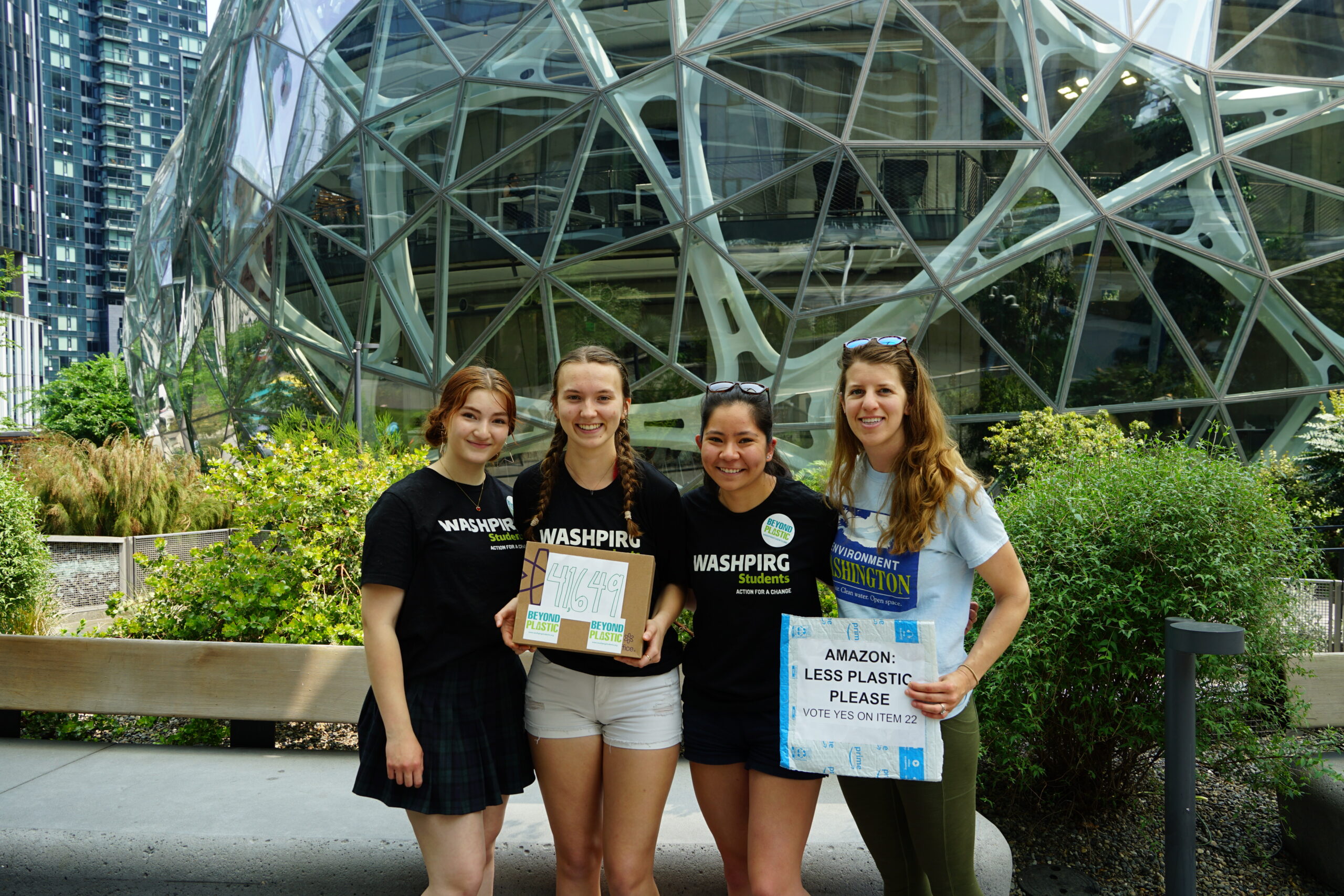 Advocates with Environment Washington in front of the Amazon spheres