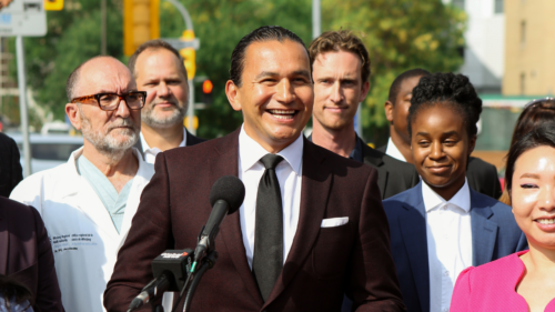 Wab Kinew speaks at a press conference