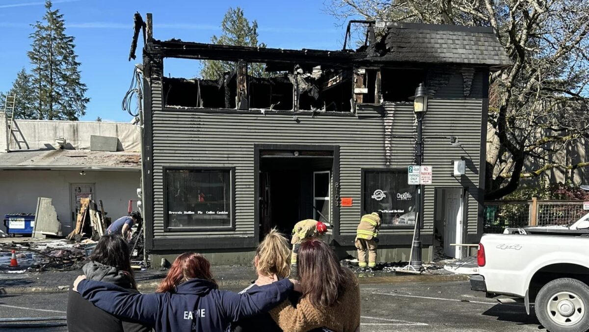 Firefighters clean up from a devastating blaze in downtown Snoqualmie