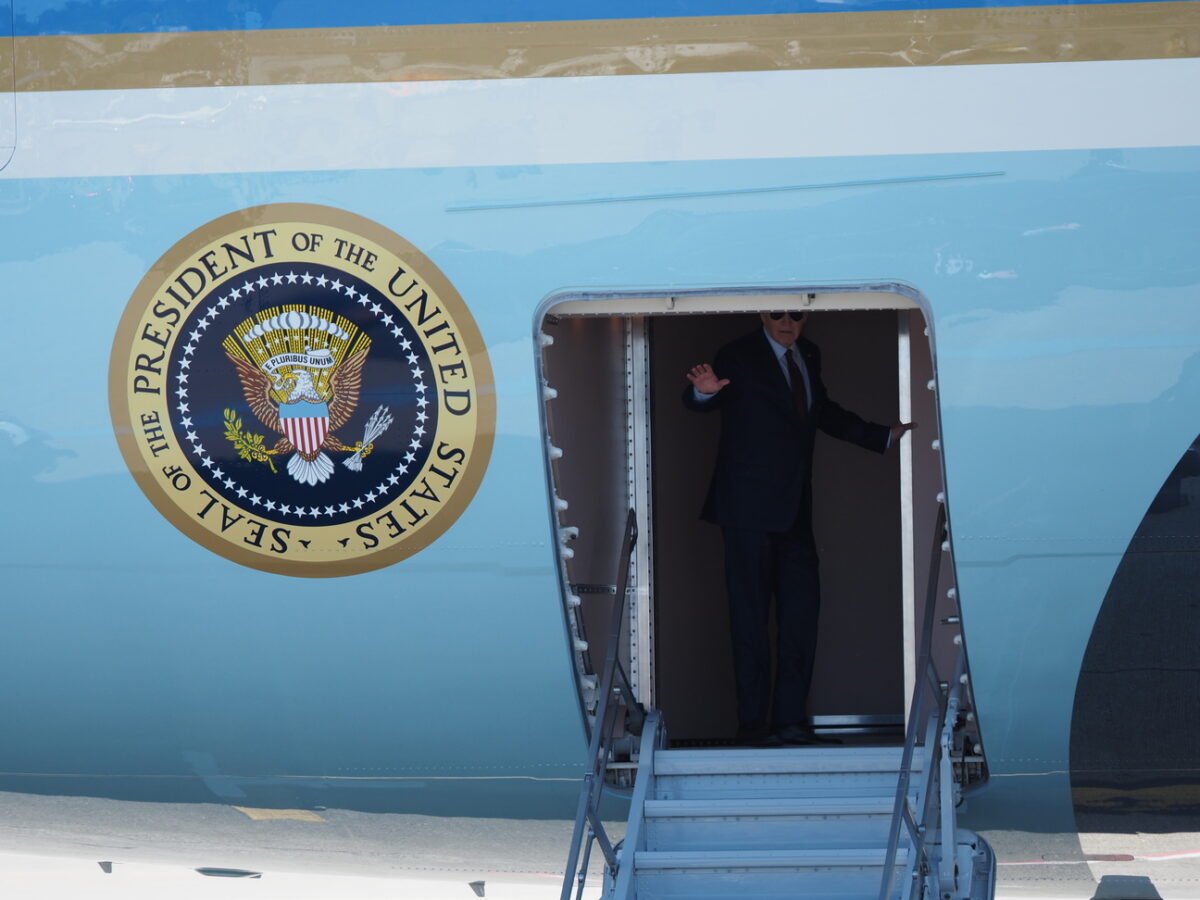 President Biden waves after boarding Air Force One